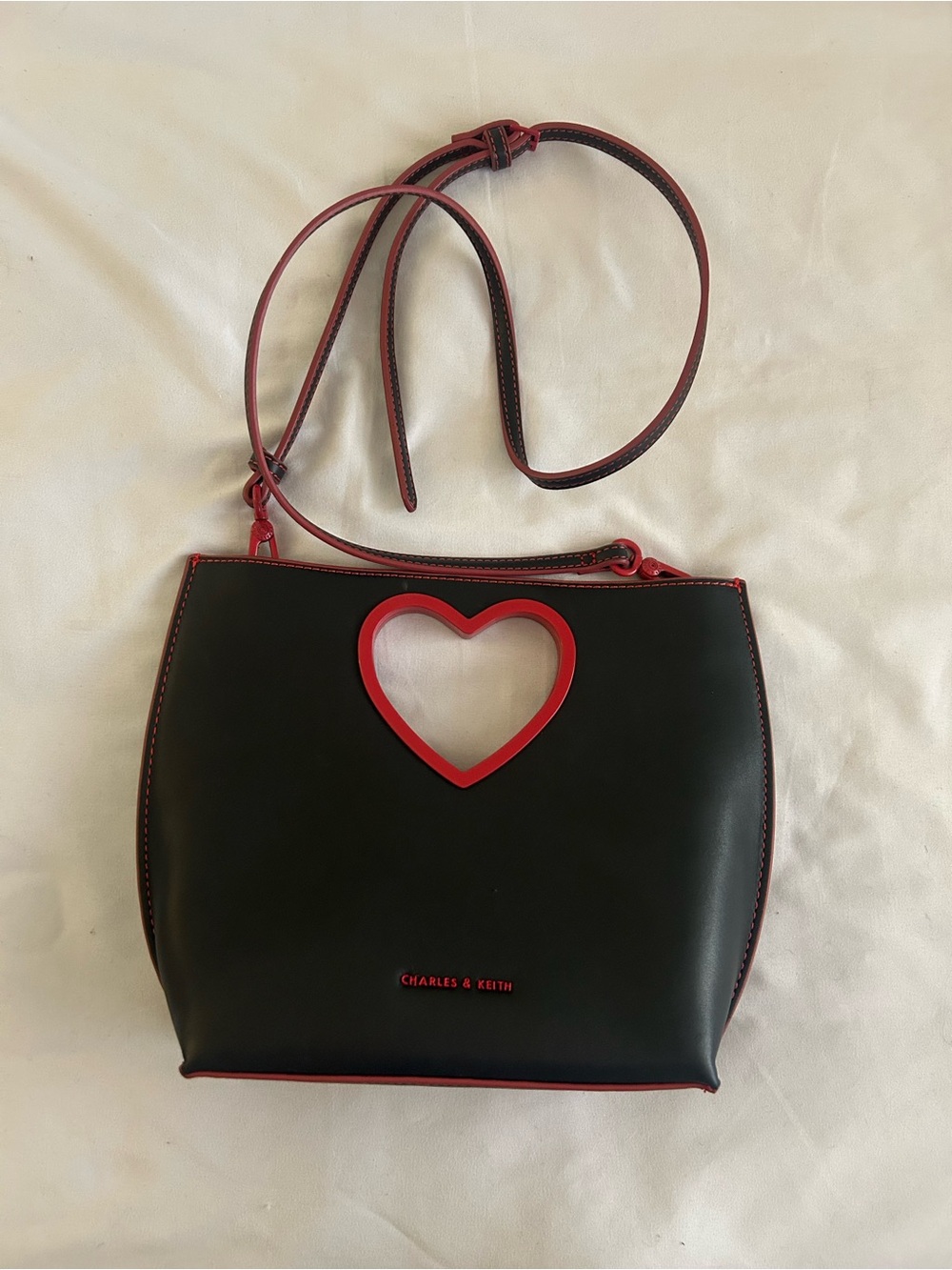 Charles & Keith Black Crossbody with Red Heart Cutout Detail